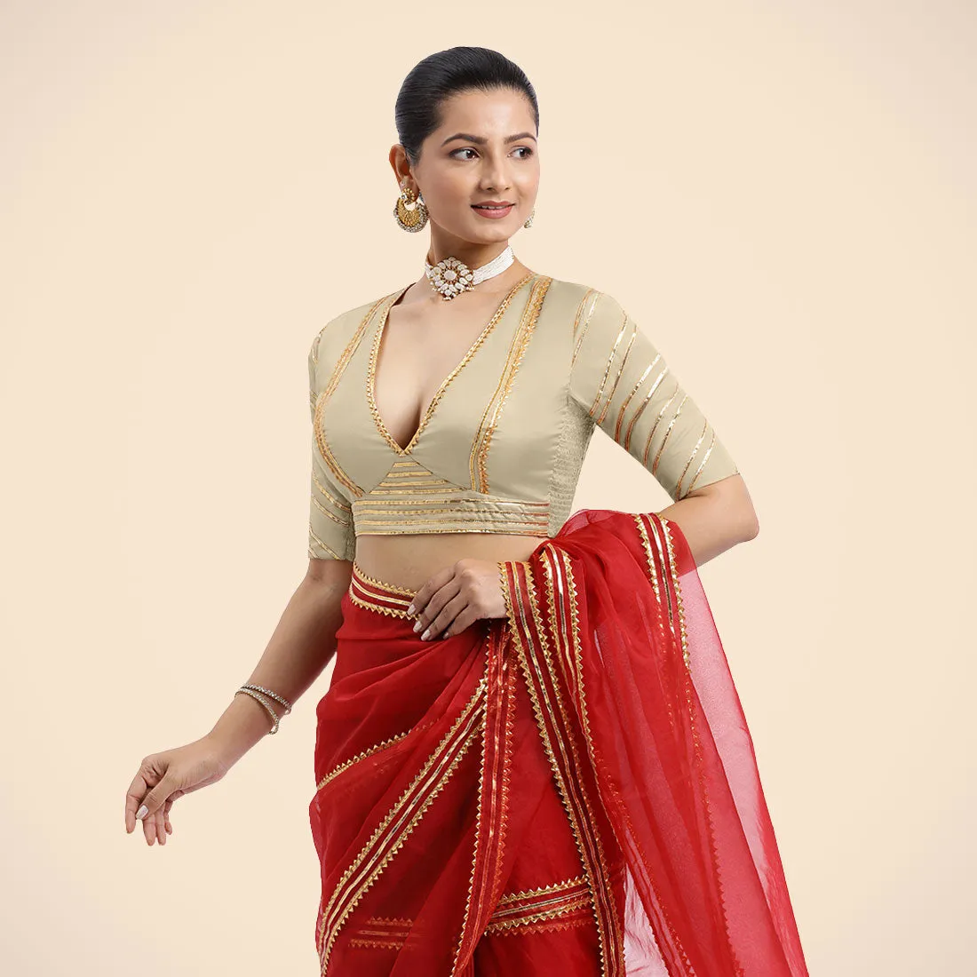 Navya x Tyohaar | Cream Elbow Sleeves FlexiFit™ Saree Blouse with Plunging V Neckline with Tasteful Golden Gota Lace