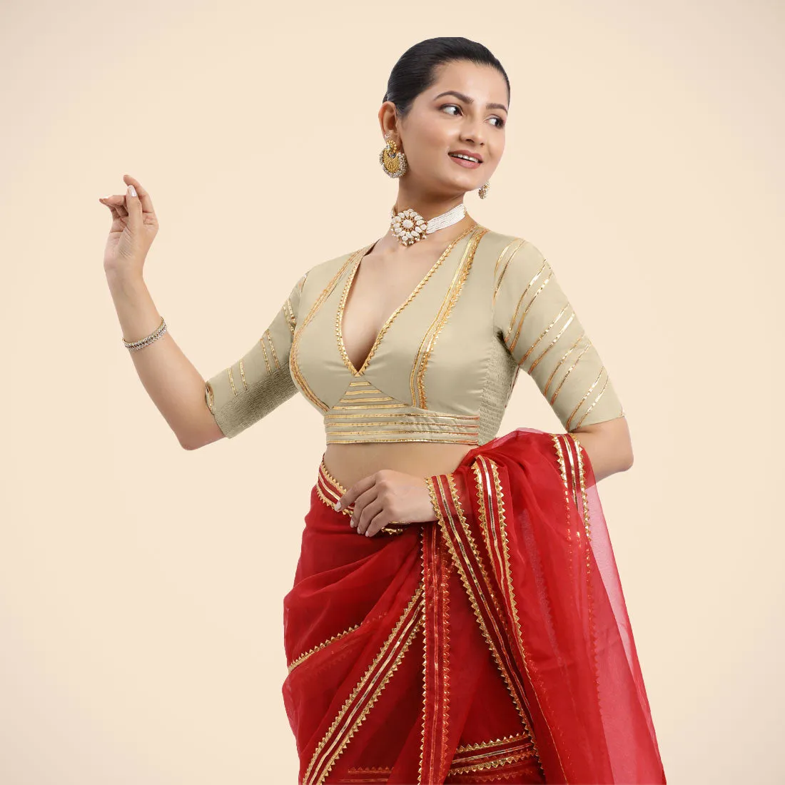 Navya x Tyohaar | Cream Elbow Sleeves FlexiFit™ Saree Blouse with Plunging V Neckline with Tasteful Golden Gota Lace